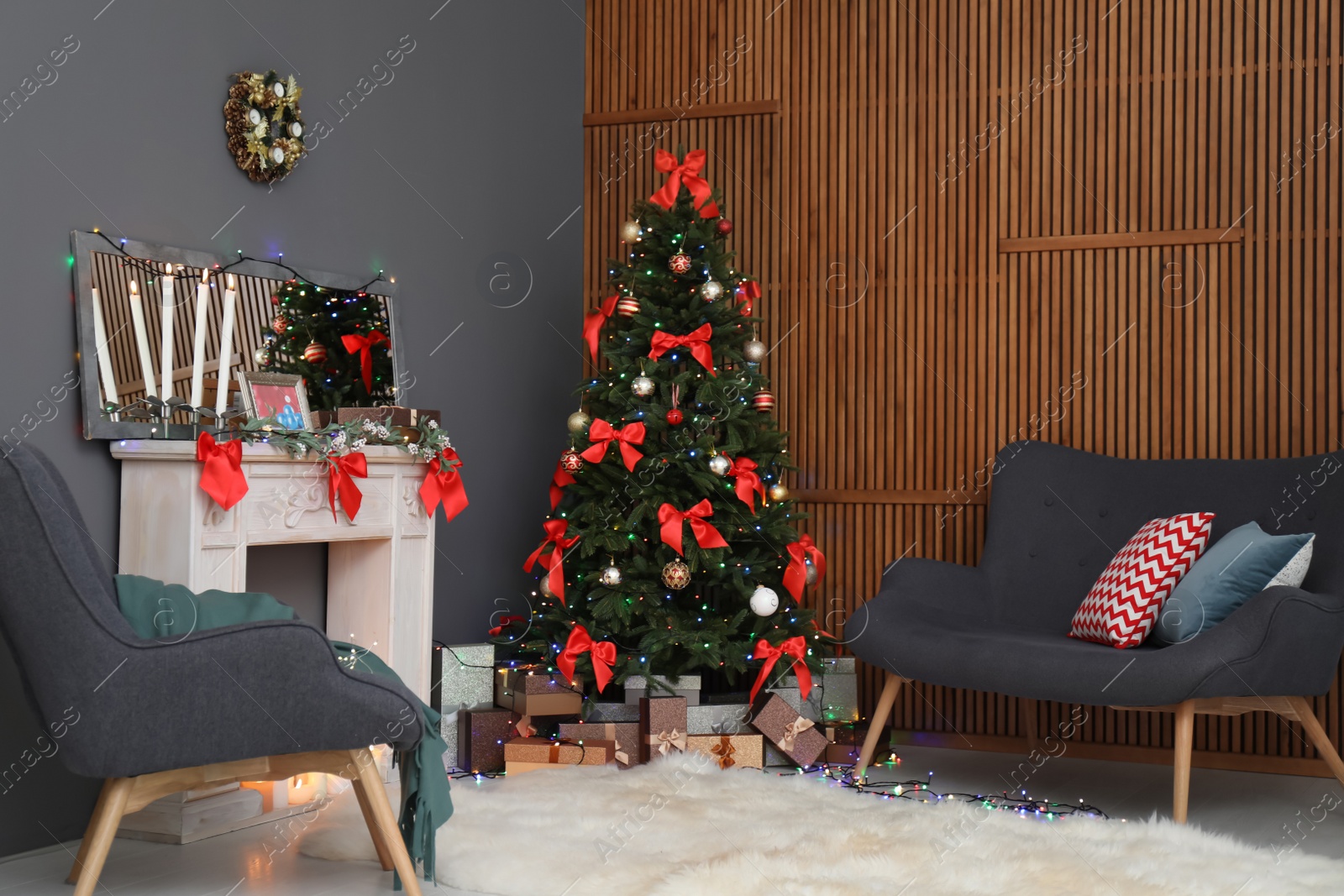 Photo of Stylish living room interior with decorated Christmas tree