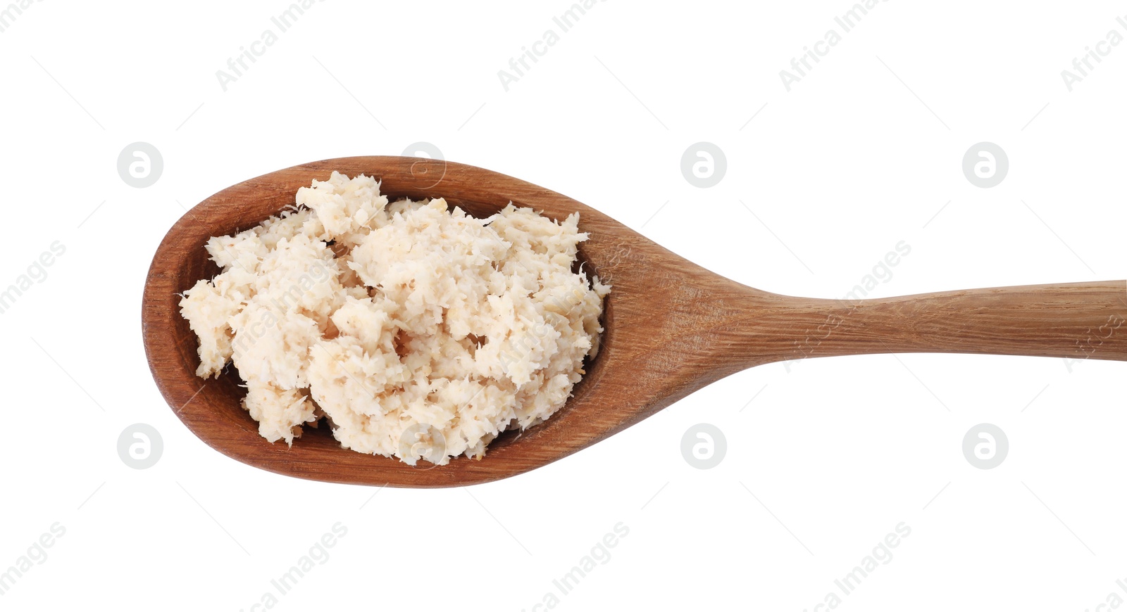 Photo of Wooden spoon with tasty prepared horseradish isolated on white, top view