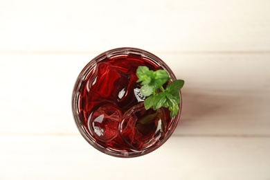 Photo of Glass with delicious refreshing cocktail, top view