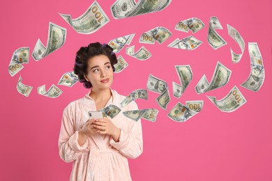Image of Online payment. Woman buying something using mobile phone on pink background. Dollar banknotes flying out of gadget demonstrating process of money transaction