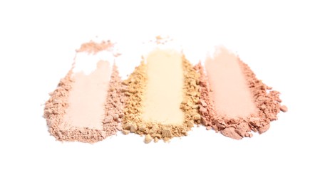 Photo of Swatches of different crushed face powders on white background