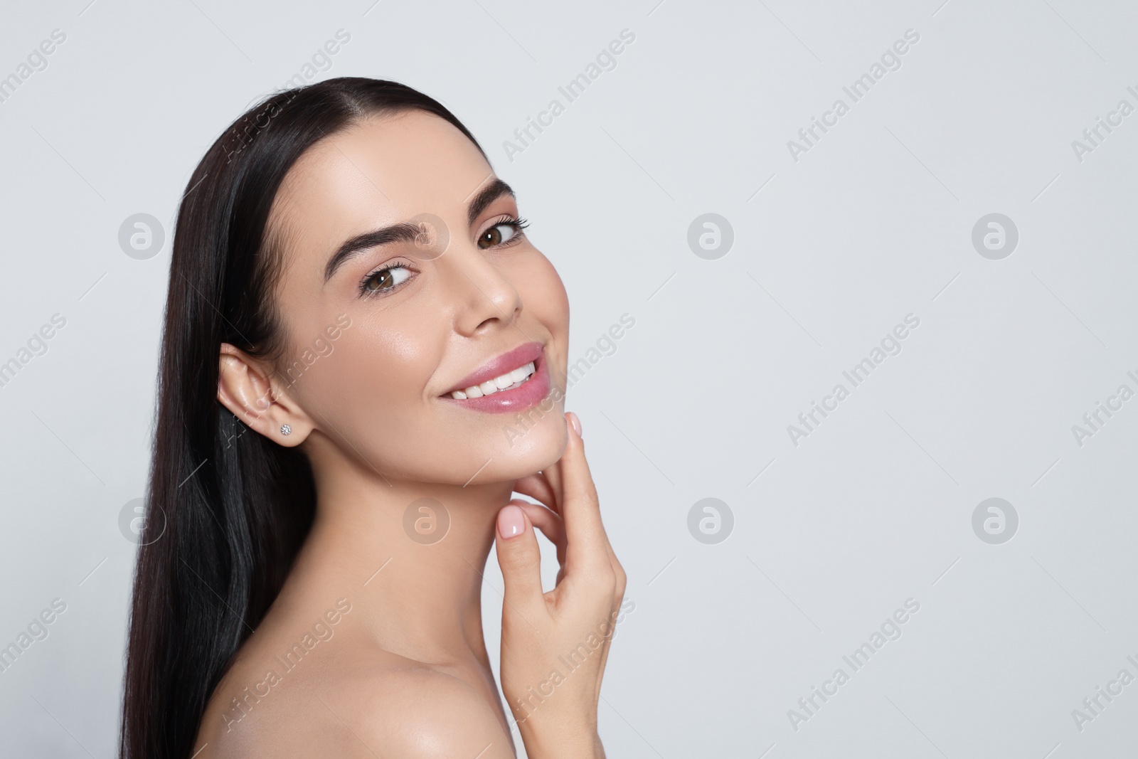 Photo of Portrait of attractive young woman on light grey background, space for text. Spa treatment