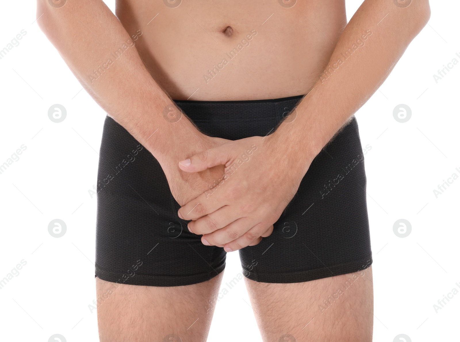 Photo of Man suffering from pain on white background, closeup. Urology problems