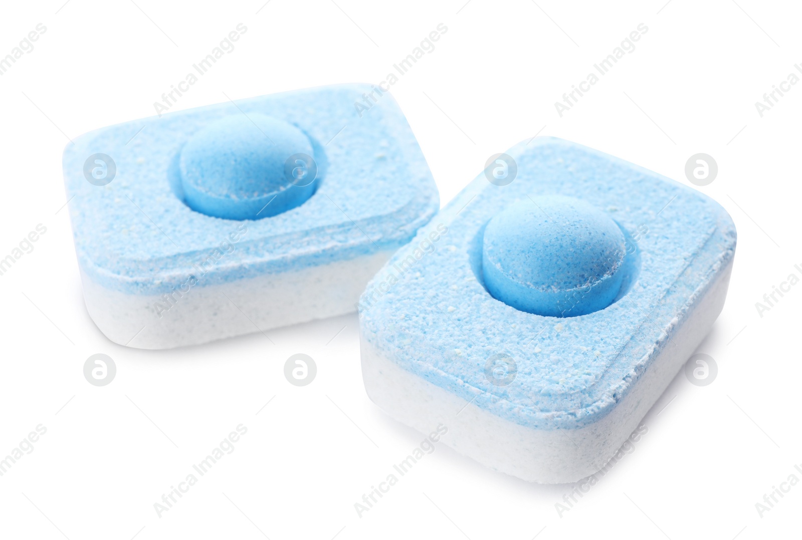 Photo of Two water softener tablets isolated on white