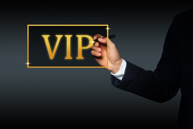 Image of VIP member. Closeup view of man pointing at virtual abbreviation on dark background
