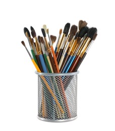 Photo of Set of paintbrushes in holder on white background