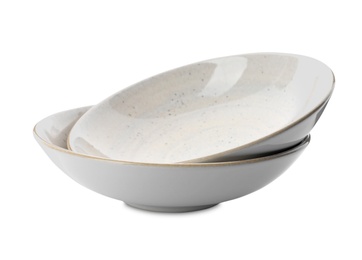 Photo of Clean empty ceramic bowls on white background