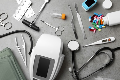 Photo of Flat lay composition with different medical objects on grey background