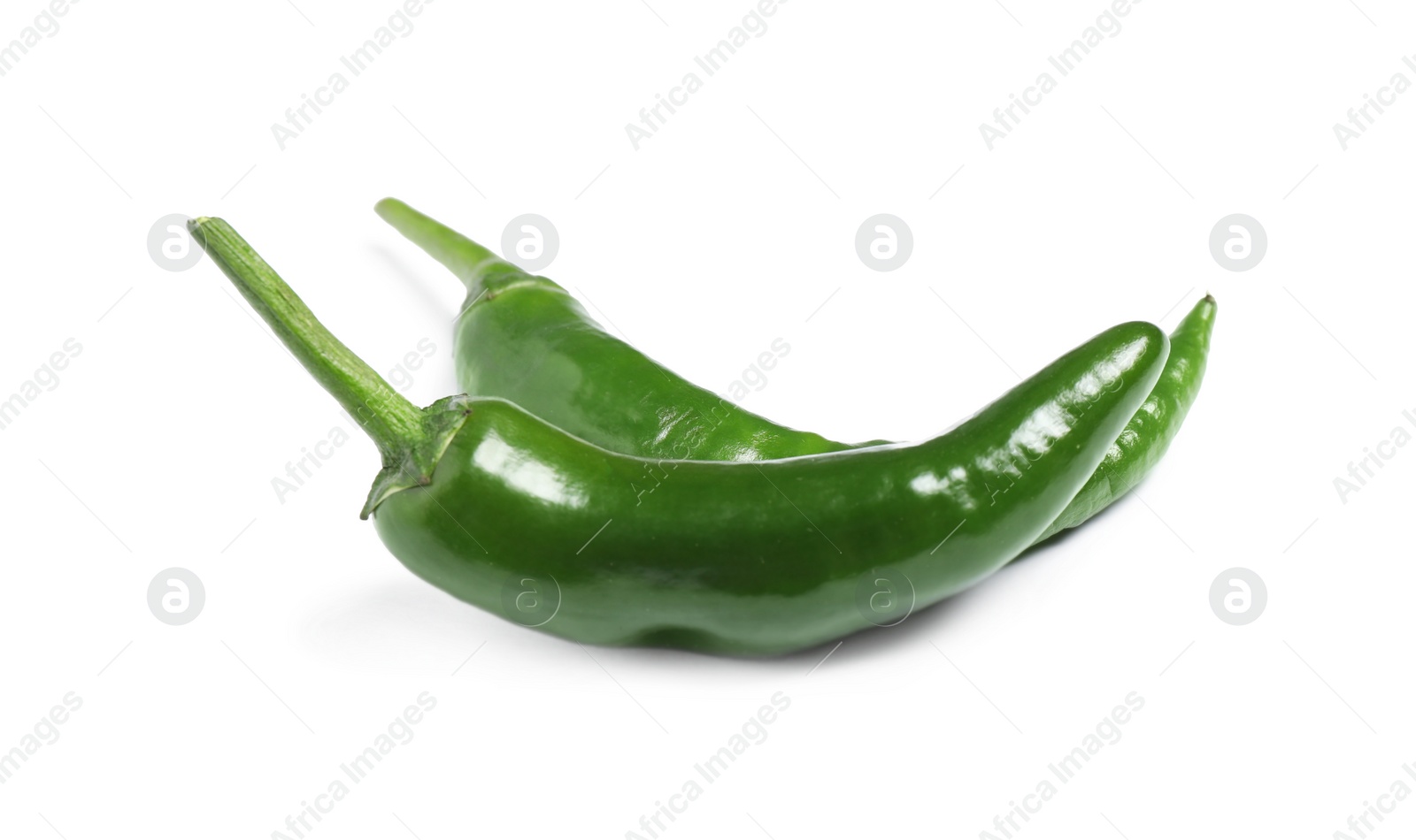 Photo of Green hot chili peppers on white background