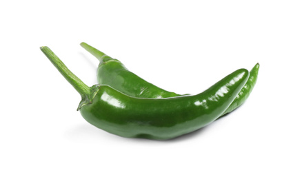 Green hot chili peppers on white background