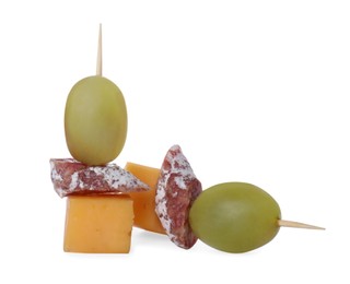 Photo of Toothpick appetizers. Tasty cheese, sausage and grapes on white background
