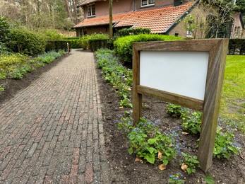 Luxury hotel, pathway and sign board outdoors