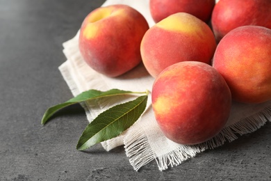 Fresh sweet ripe peaches on table