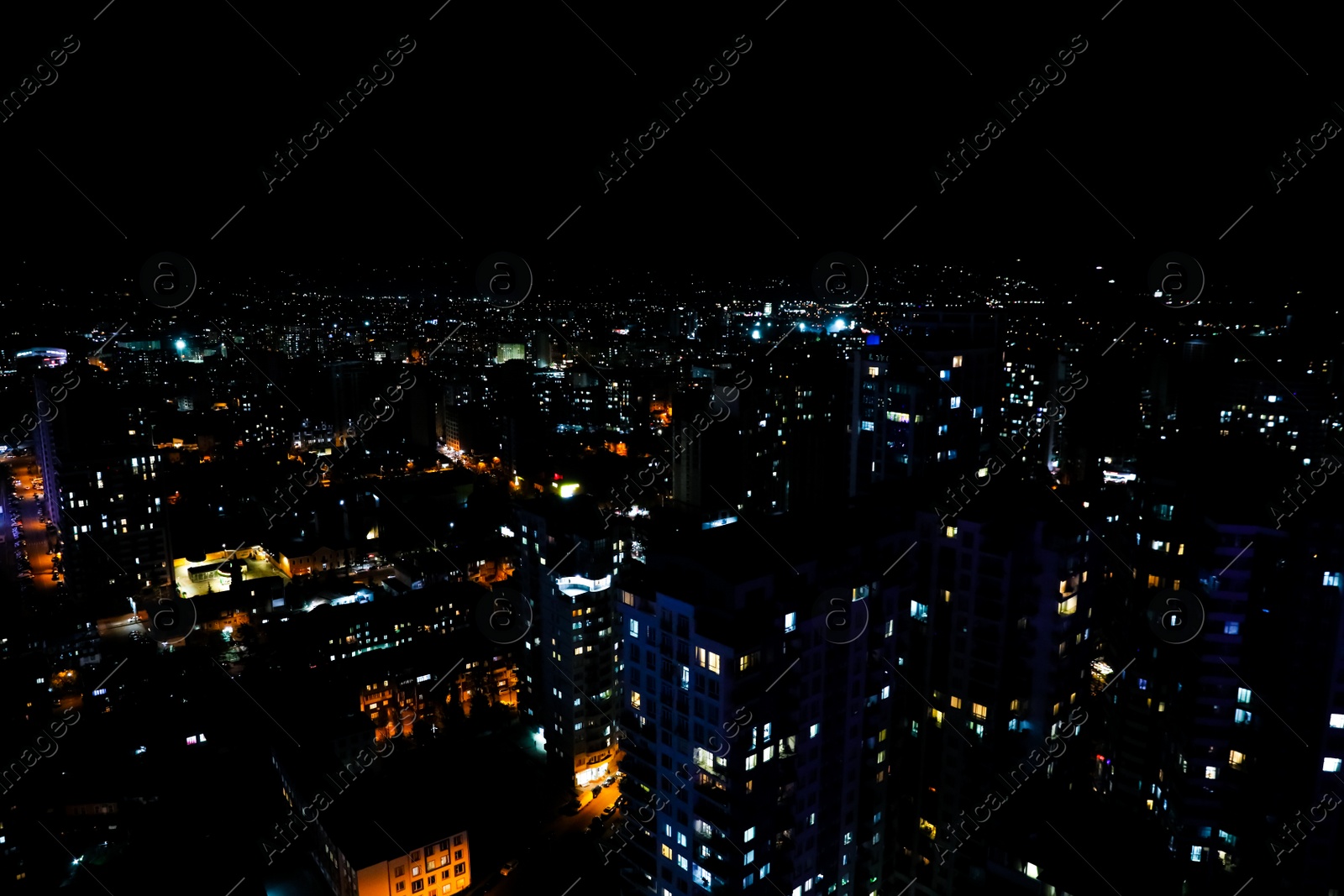 Photo of Picturesque view of city with buildings at night