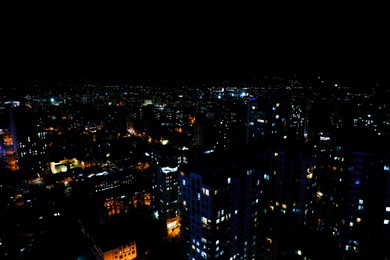 Photo of Picturesque view of city with buildings at night