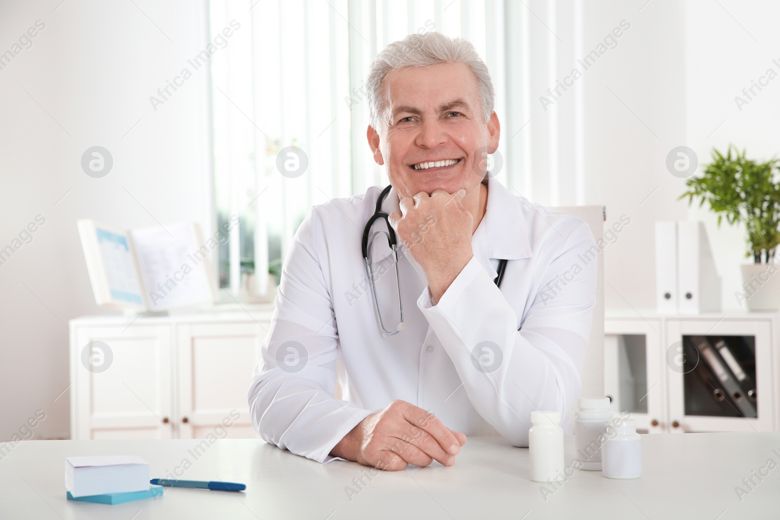 Photo of Doctor consulting patient using video chat in clinic, view from web camera