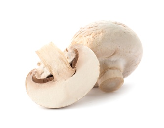 Fresh raw champignon mushrooms on white background