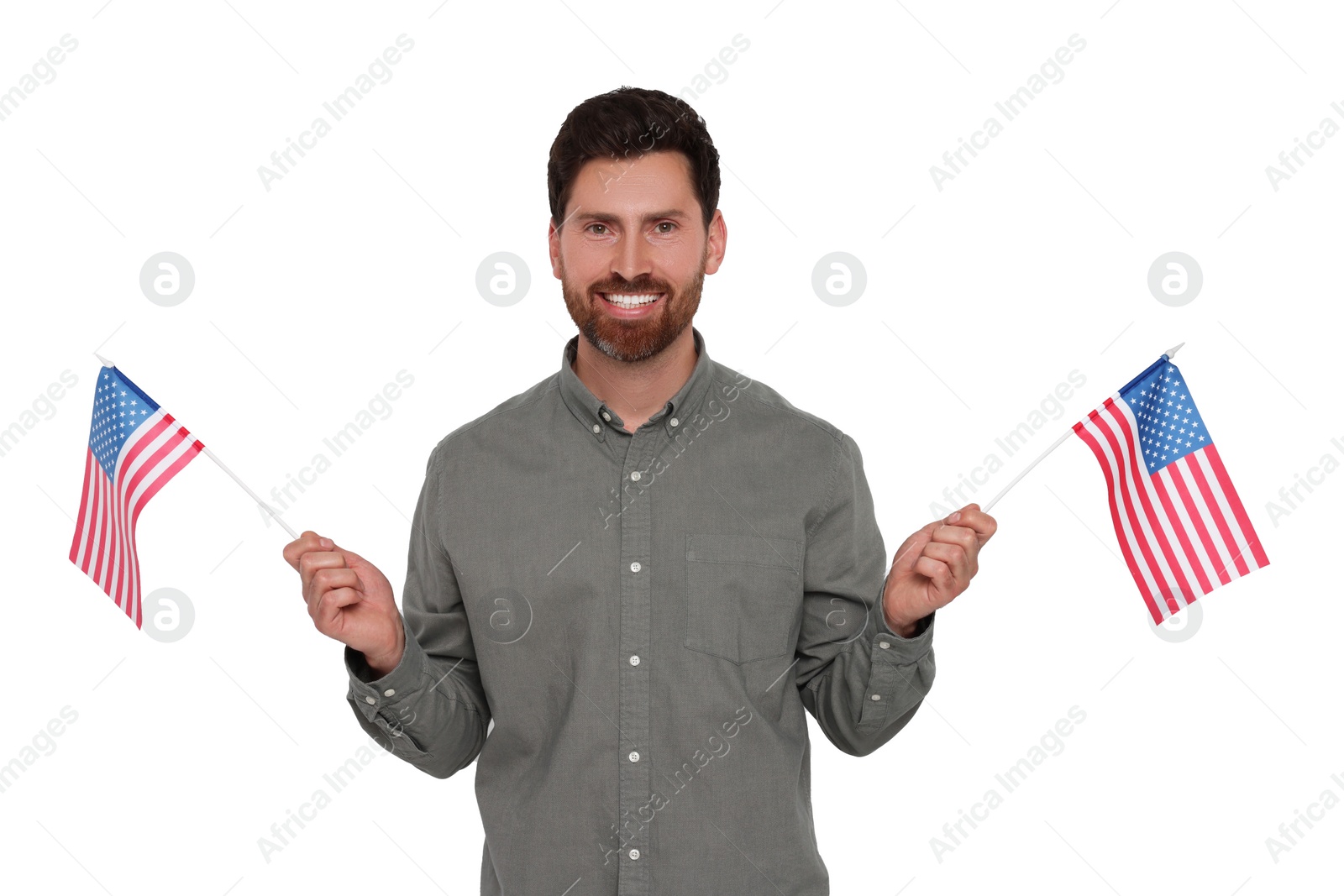 Image of 4th of July - Independence day of America. Happy man holding national flags of United States on white background