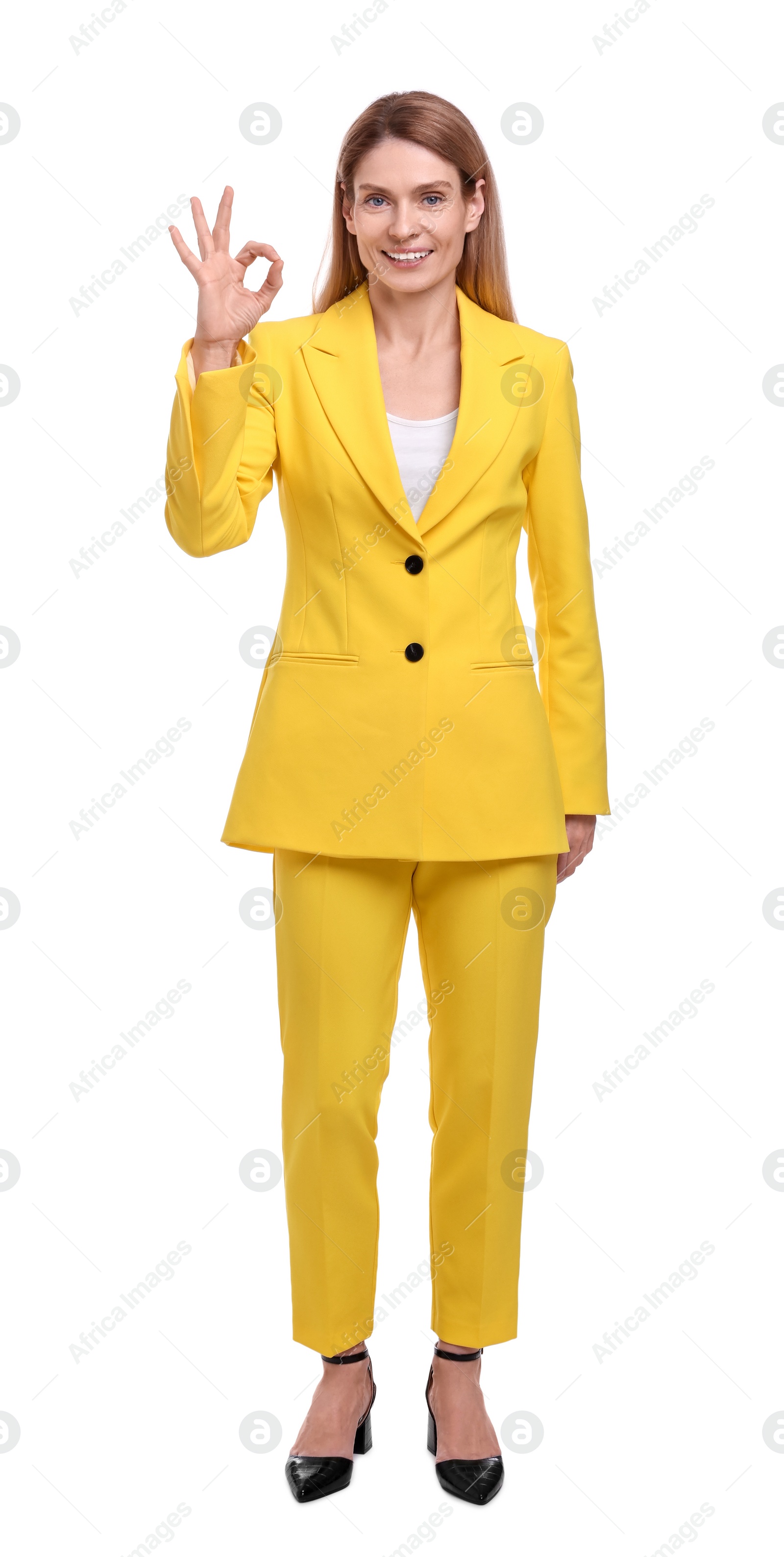 Photo of Beautiful happy businesswoman showing OK gesture on white background