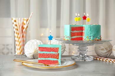 Photo of Fresh delicious cake and birthday decorations on table