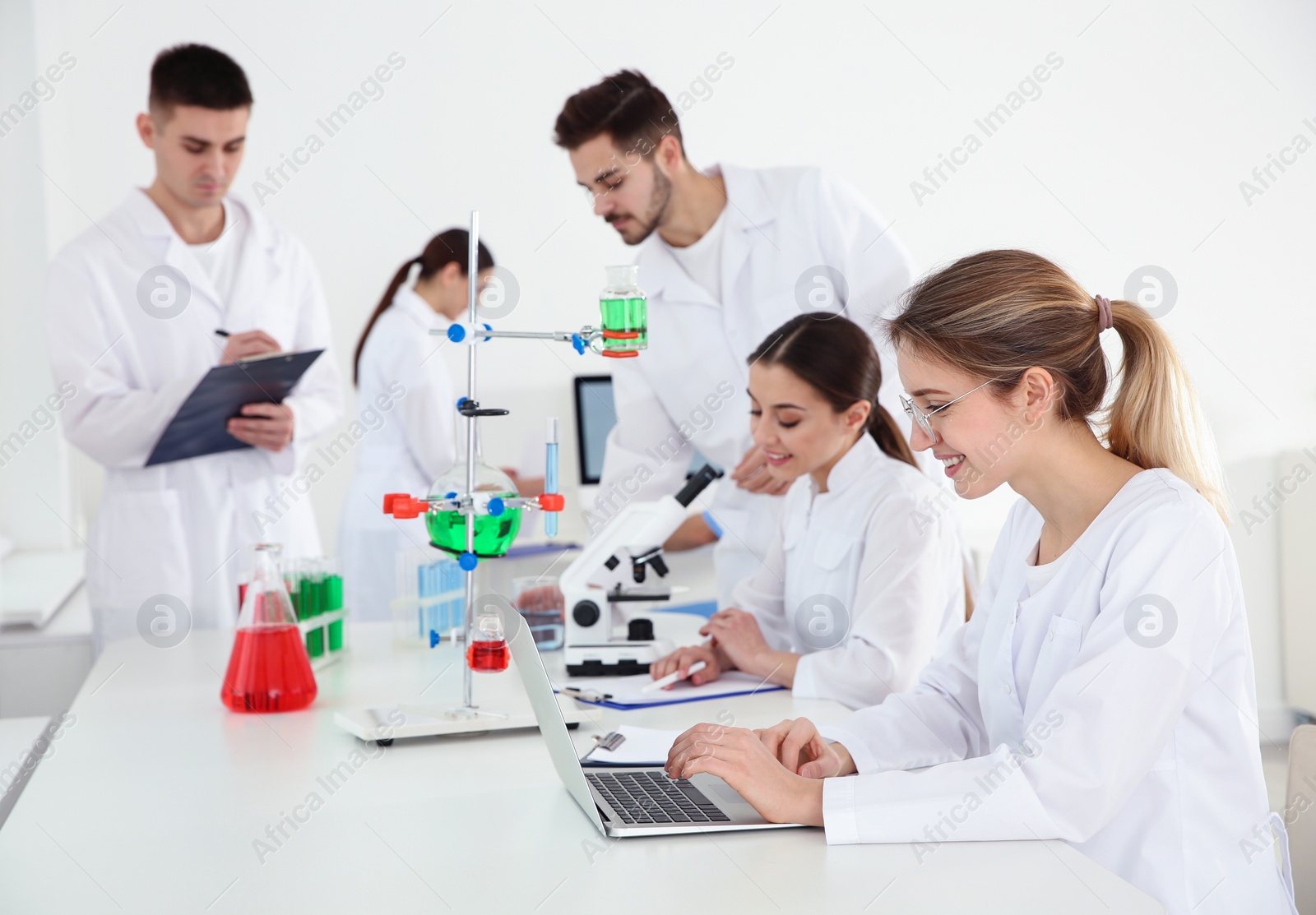 Photo of Medical students working in modern scientific laboratory