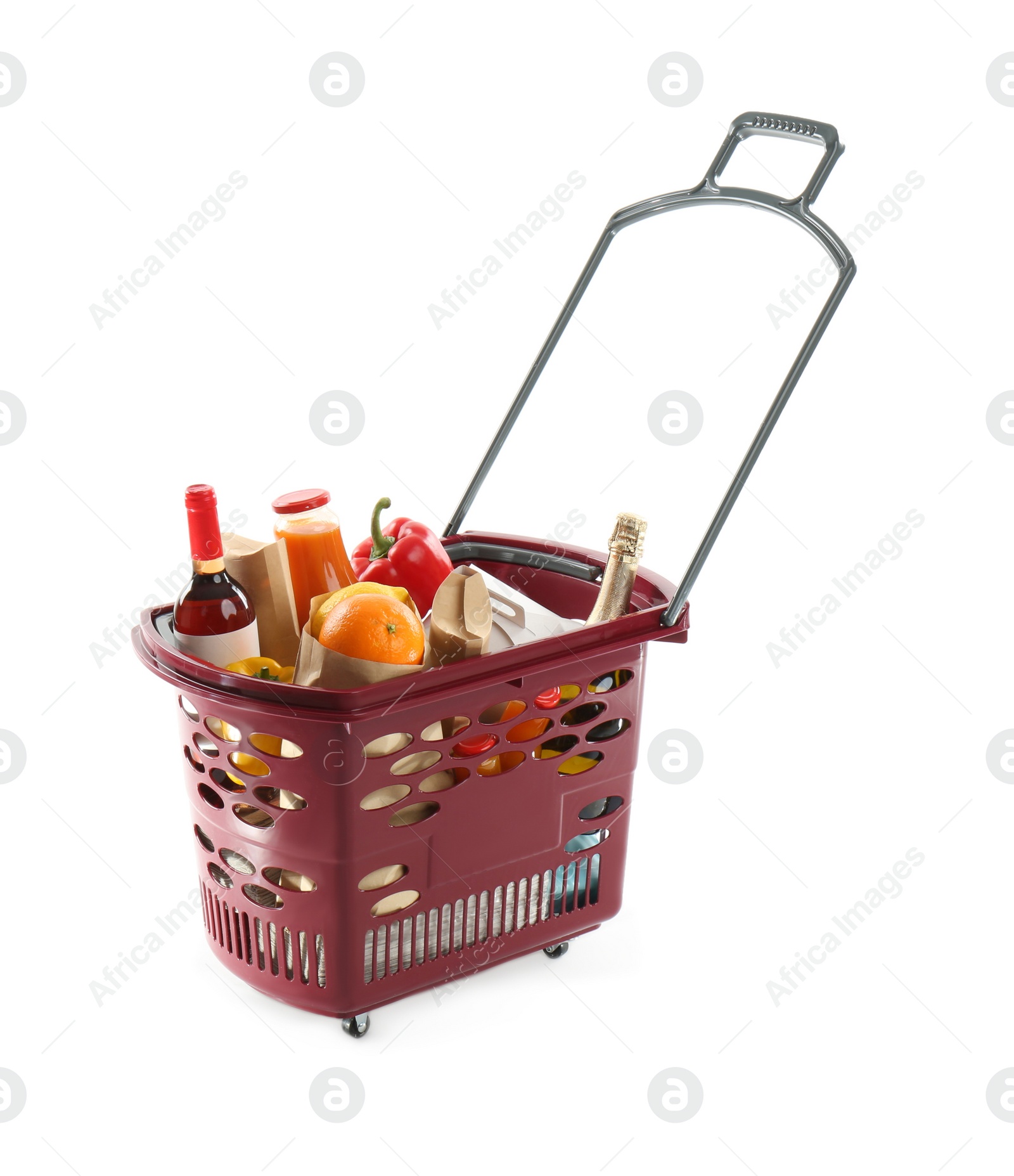 Photo of Shopping basket full of different products isolated on white