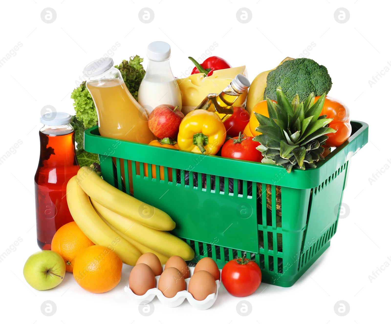 Photo of Shopping basket and grocery products on white background