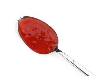 Photo of Spicy chili sauce in spoon isolated on white, top view