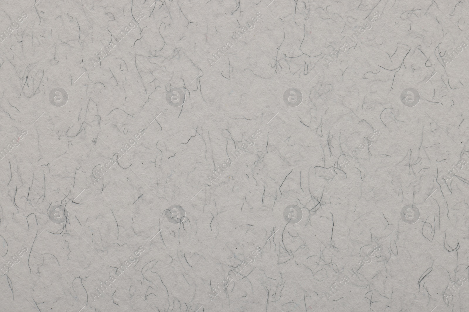 Photo of Texture of light grey paper sheet as background, top view