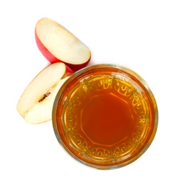 Photo of Glass of apple juice and slices of fresh fruit on white background, top view