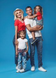 Photo of Happy family with children on blue background