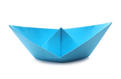 Handmade light blue paper boat isolated on white. Origami art