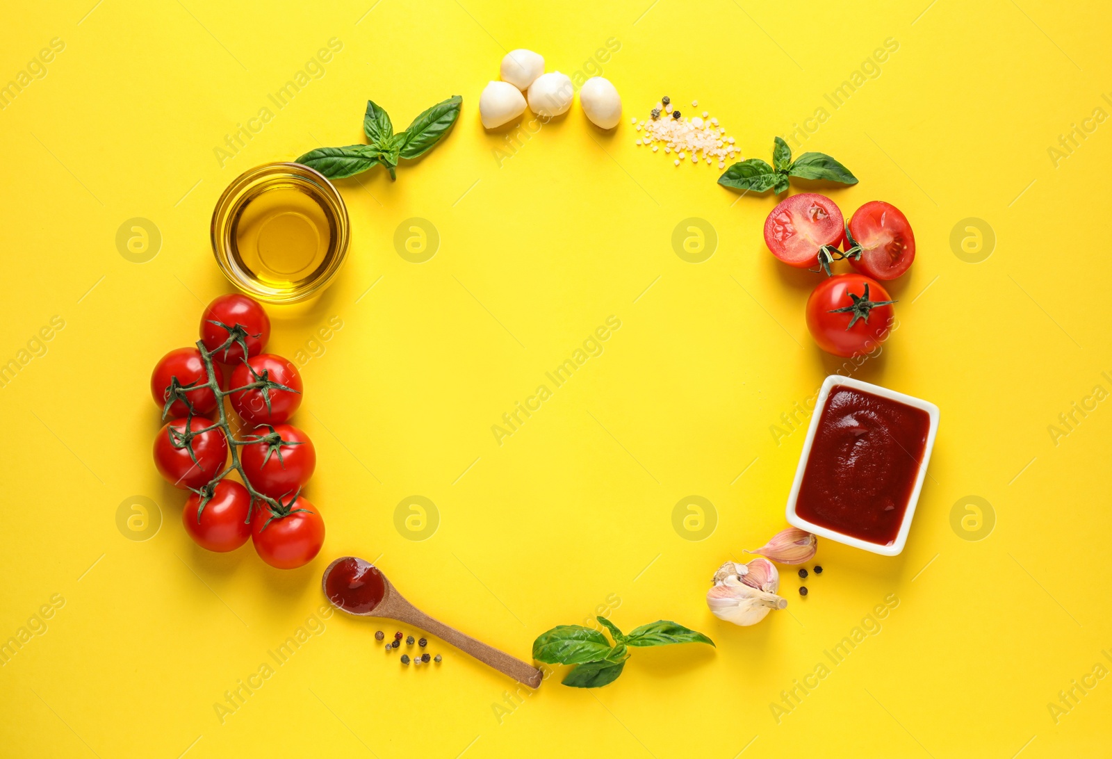 Photo of Flat lay composition with fresh pizza ingredients on yellow background. Space for text