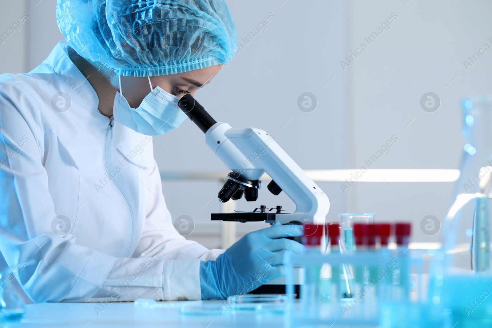 Photo of Scientist working with microscope in laboratory. Medical research