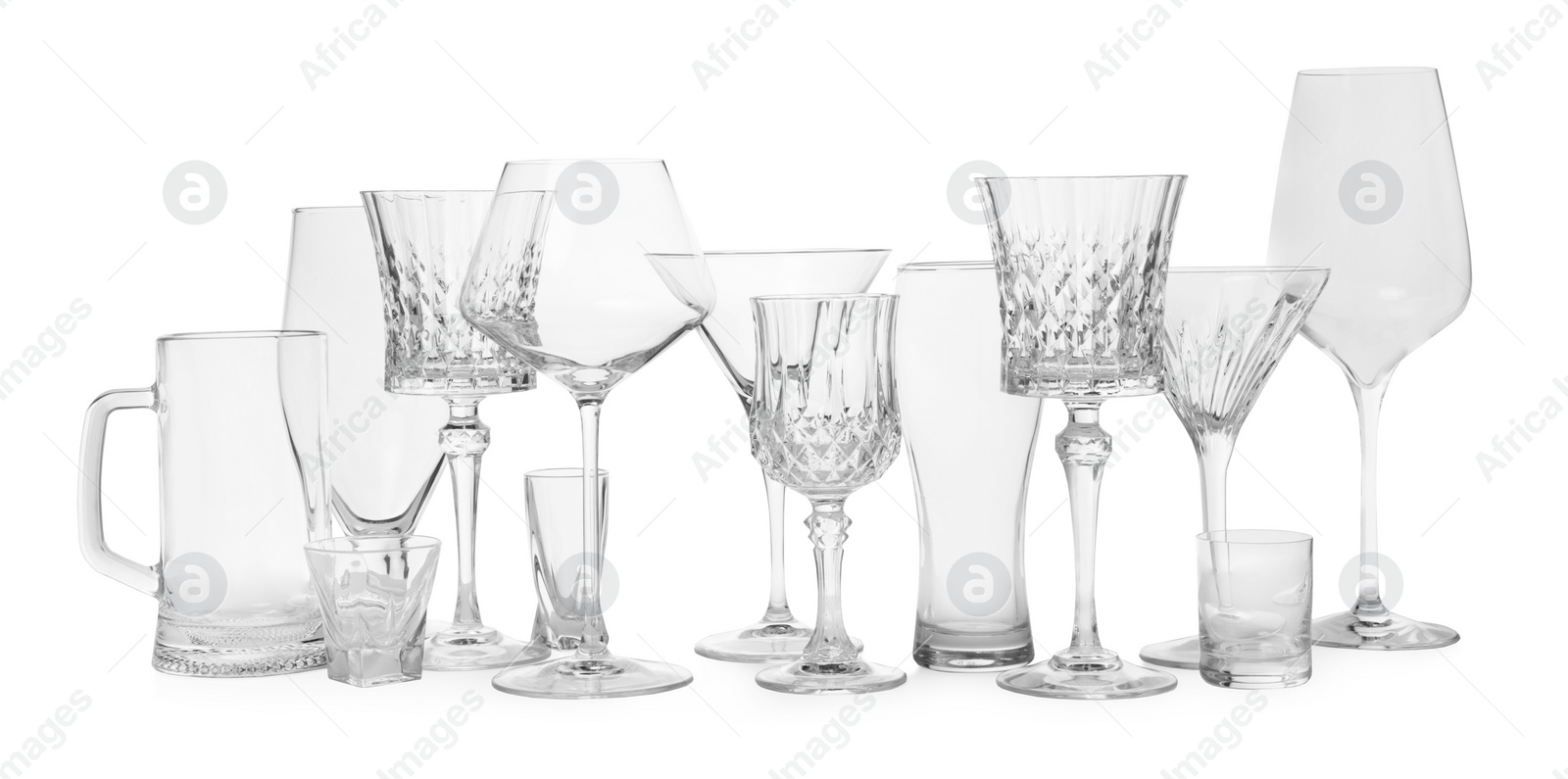 Photo of Different elegant empty glasses isolated on white