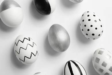 Photo of Painted Easter eggs on white background, top view