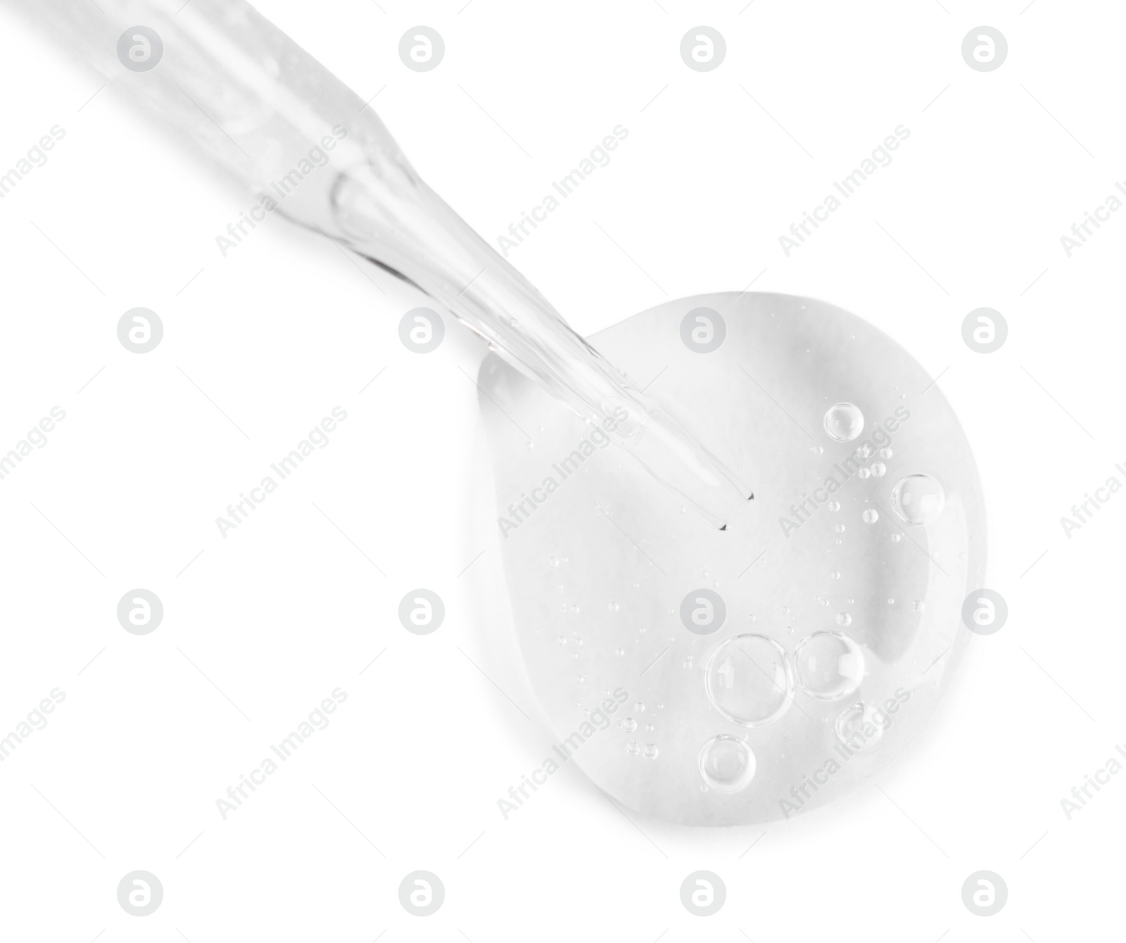 Photo of Glass pipette and transparent liquid isolated on white, top view