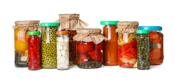 Photo of Different jars with pickled vegetables on white background