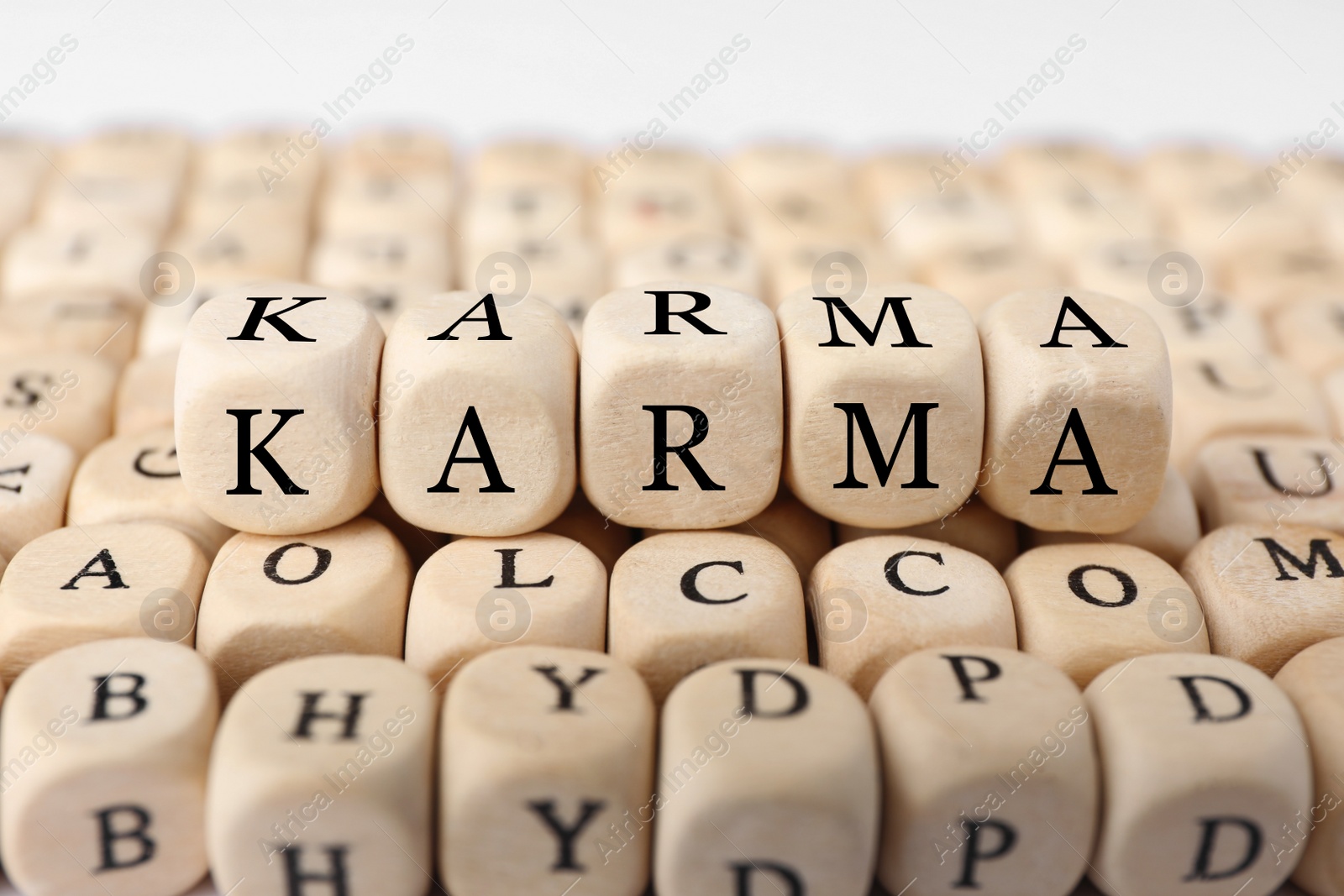 Photo of Many cubes with letters and some of them making word Karma