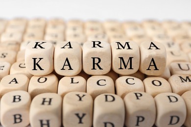 Many cubes with letters and some of them making word Karma