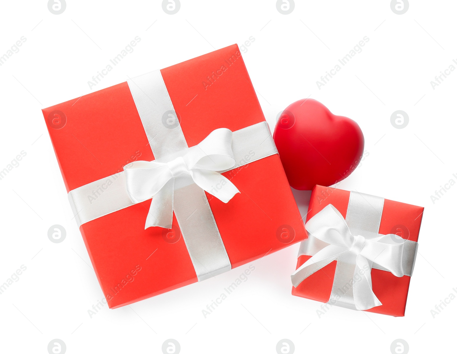 Photo of Beautiful gift boxes and red heart on white background, top view. Valentine's day celebration