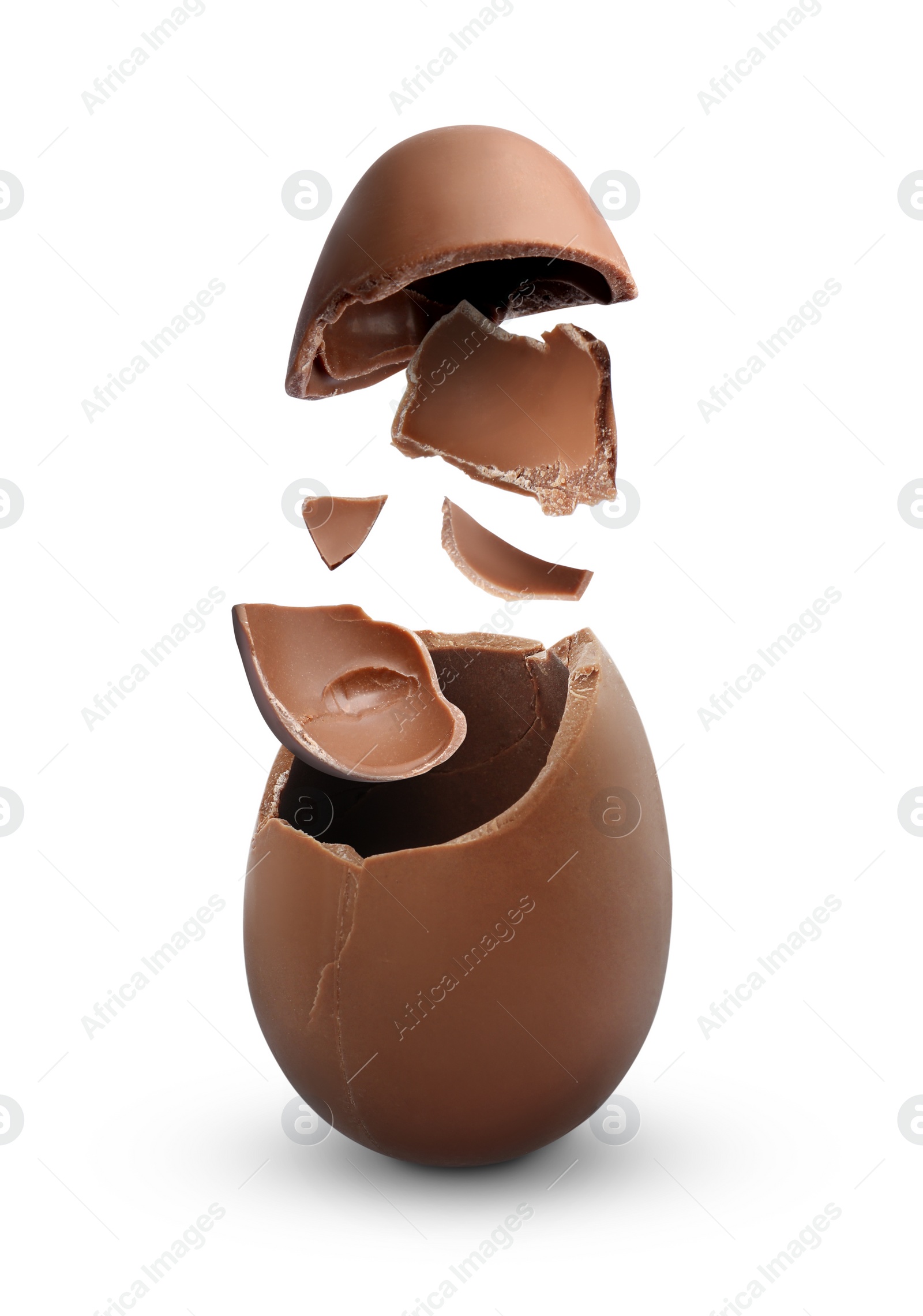 Image of Exploded milk chocolate egg on white background