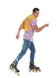 Photo of Handsome young man with inline roller skates on white background