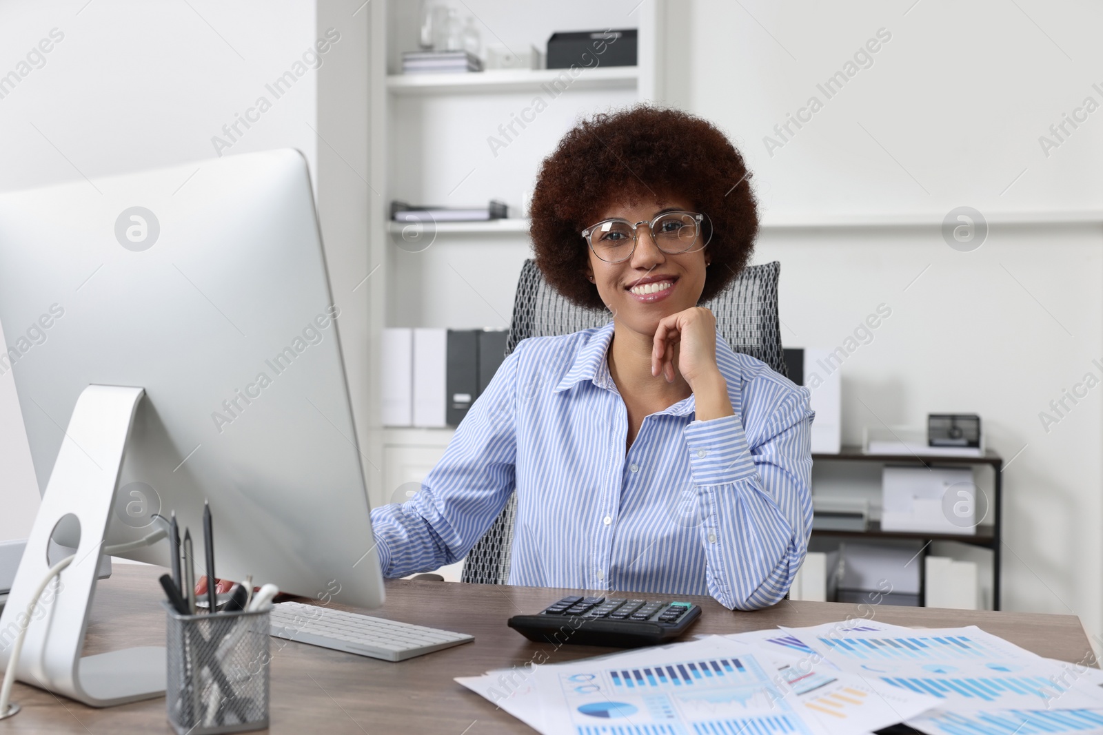 Photo of Professional accountant working on computer in office