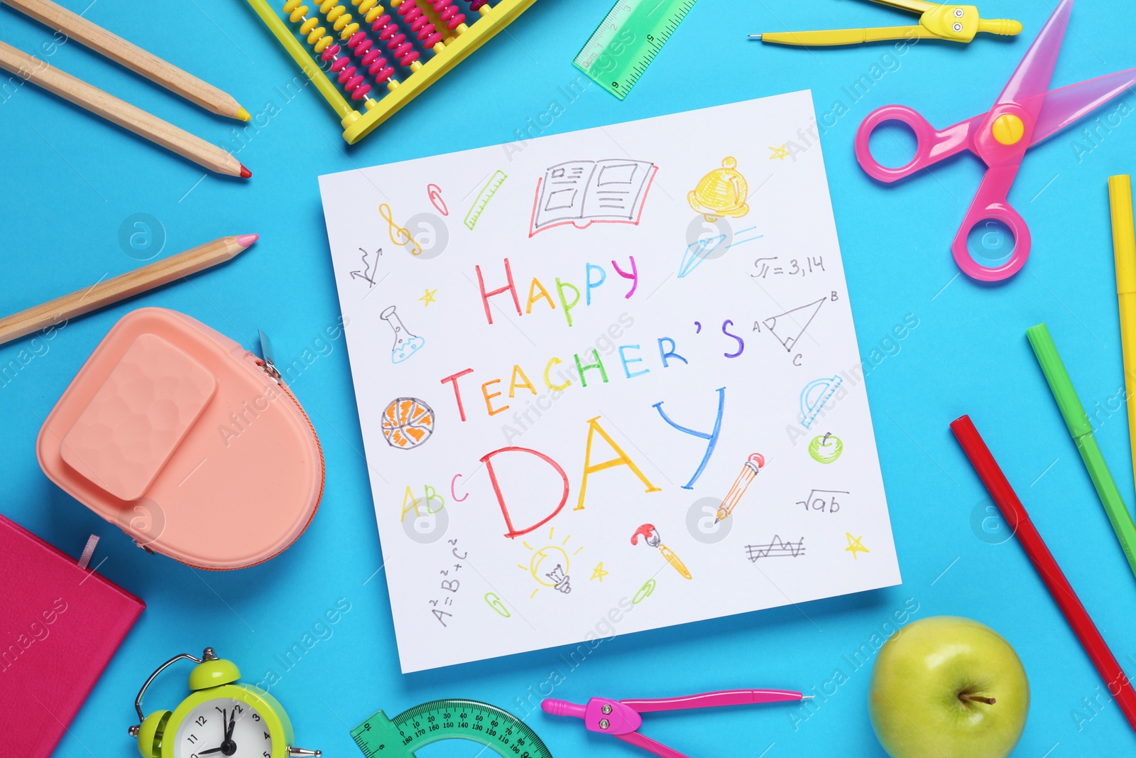 Photo of Flat lay composition of card with inscription HAPPY TEACHER'S DAY and stationery on blue background