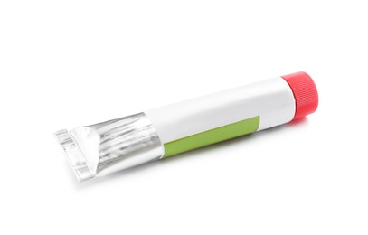 Tube with acrylic paint on white background. Artistic equipment for children