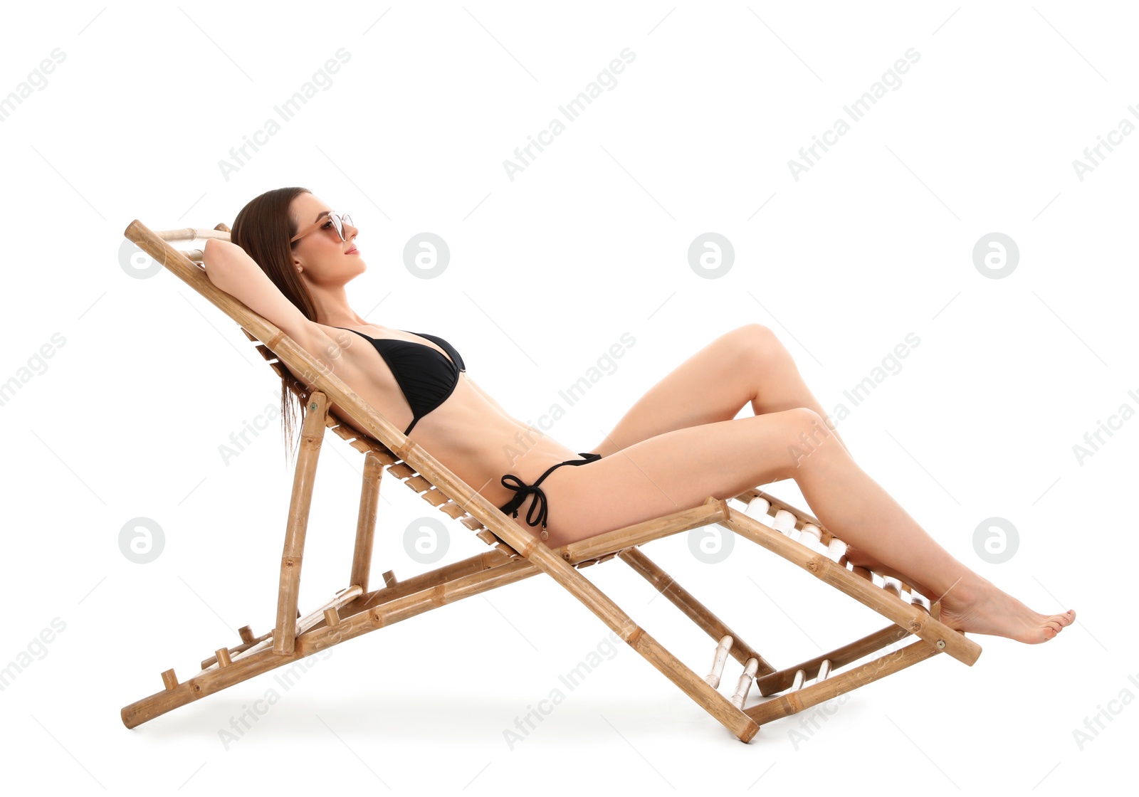 Photo of Young woman on sun lounger against white background. Beach accessories