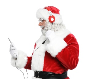 Santa Claus listening to Christmas music on white background