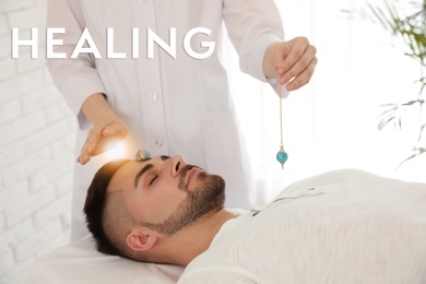 Image of Young man during crystal healing session in therapy room