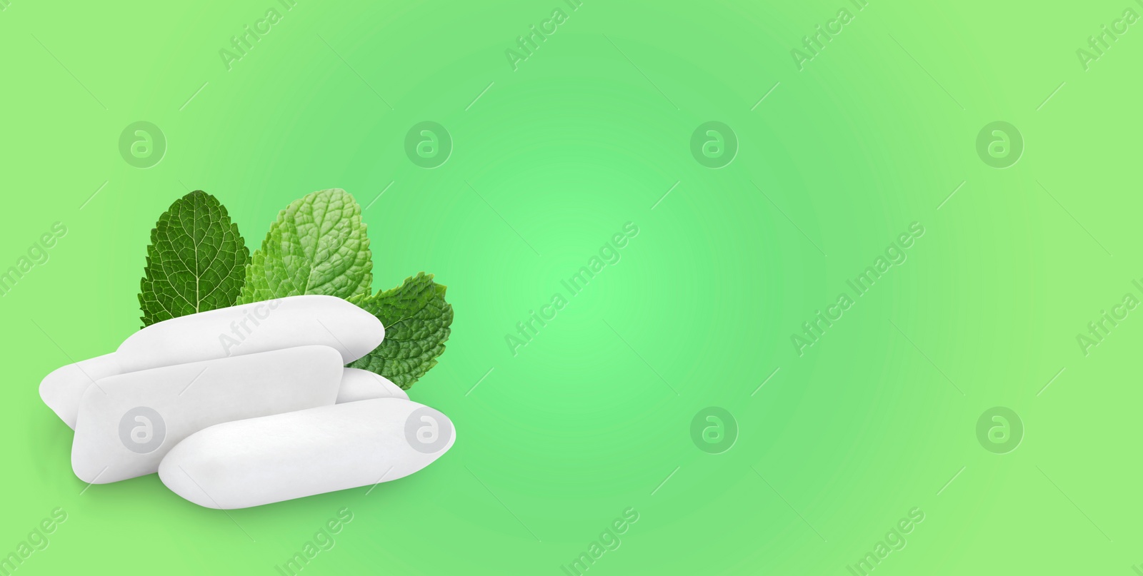 Image of Menthol chewing gum pillows and mint leaves on light green gradient background, space for text. Banner design